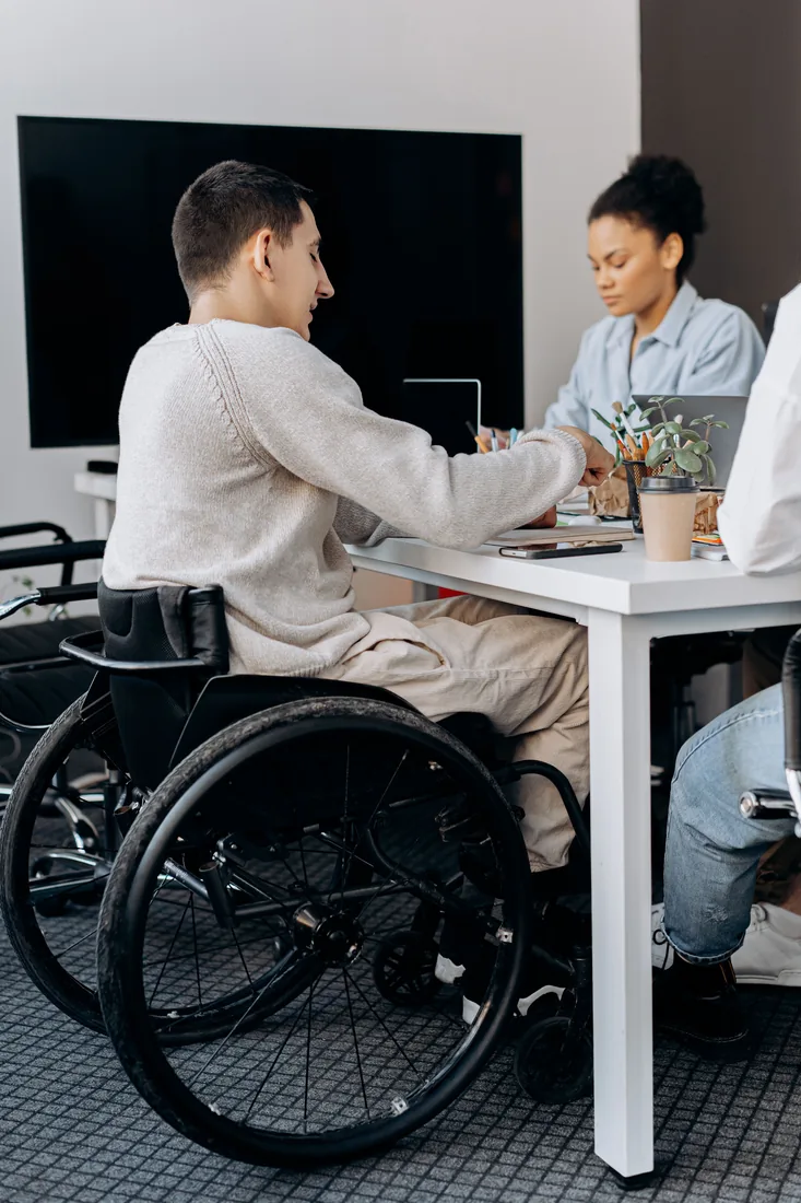 Inclusive workplace collaboration with a wheelchair user